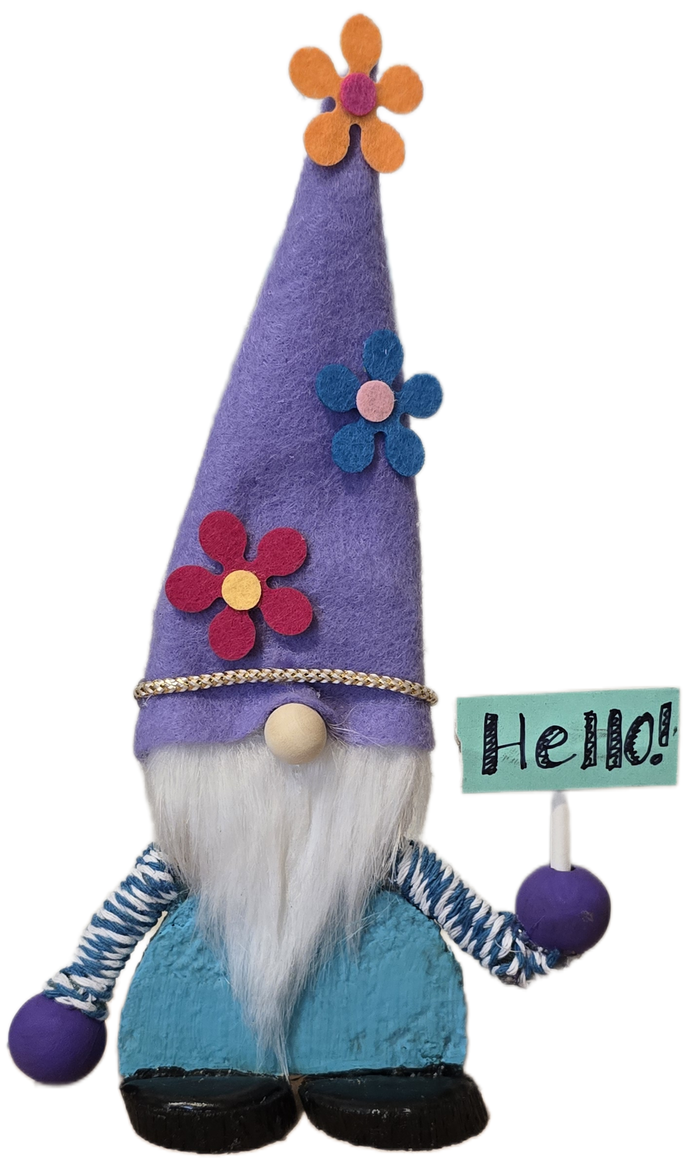 Colorful gnome figurine with a purple hat and blue pants, holding a 'Hello!' sign.